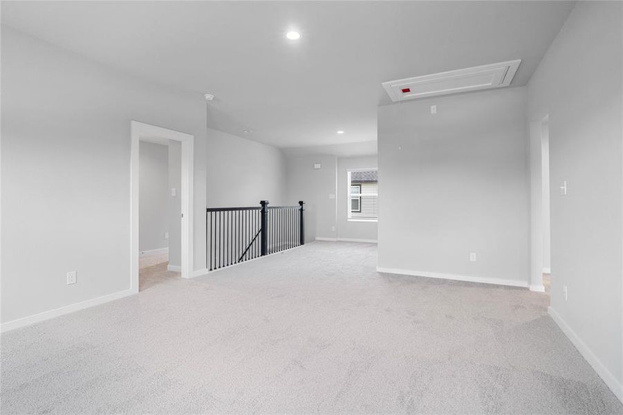 Another view from the Game Room looking towards the staircase, and secondary bedrooms.