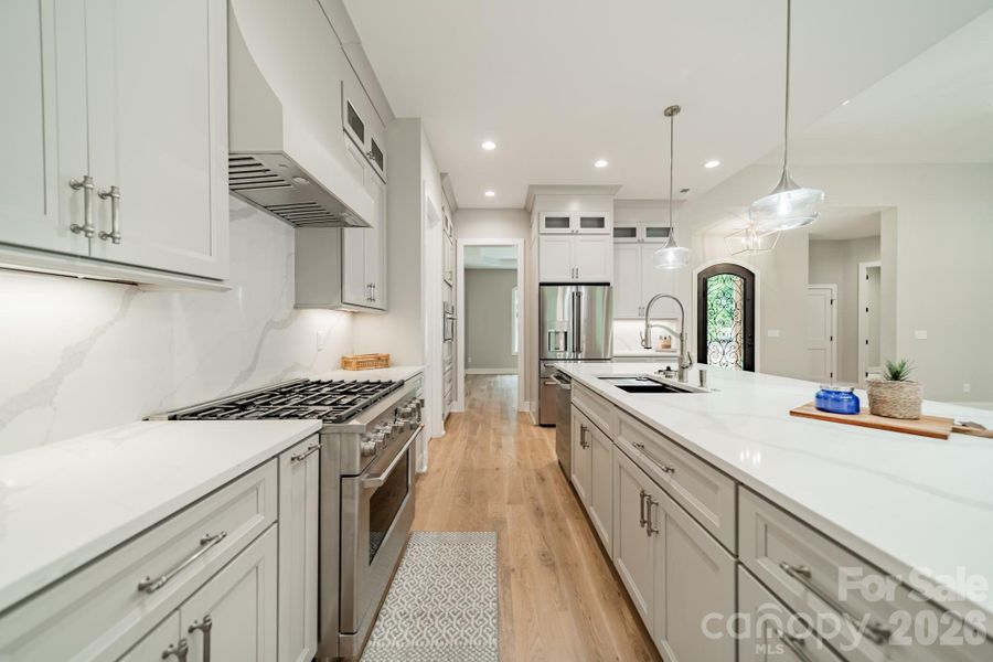 Enjoy the grand Chef's Kitchen and Quartz Island