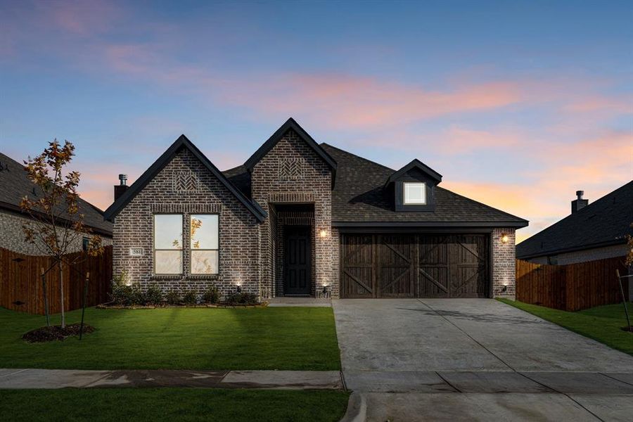 Front exterior of a new home in The Retreat at North Grove 60, Waxahachie, TX, highlighting curb appeal (Image 2).