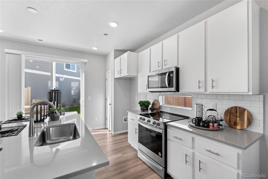 Furnished interior view inside a new home in , Commerce City (Image 13).