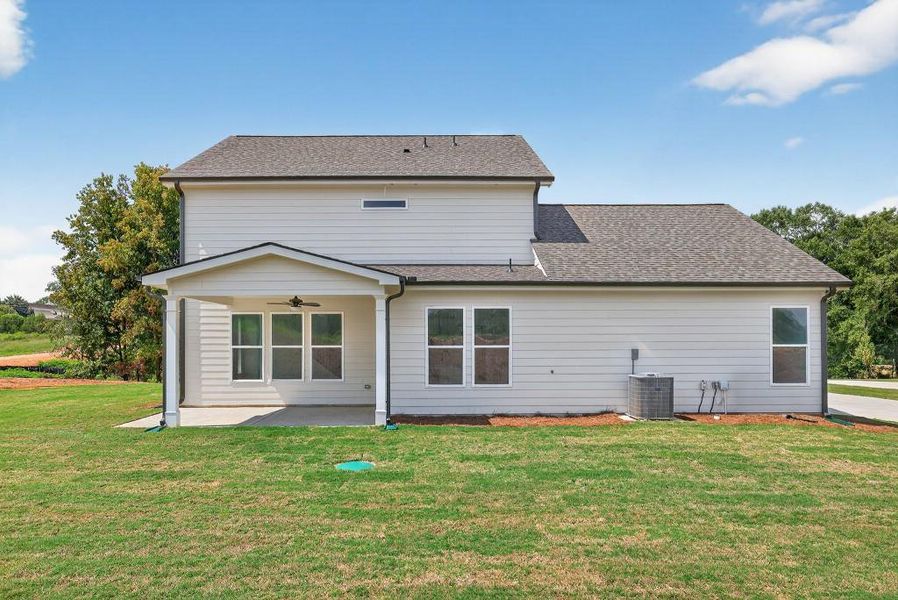Front exterior of a new home in Magnolia Ridge, Monroe, GA, highlighting curb appeal (Image 2).
