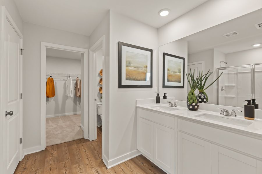 A bathroom with a large mirror.