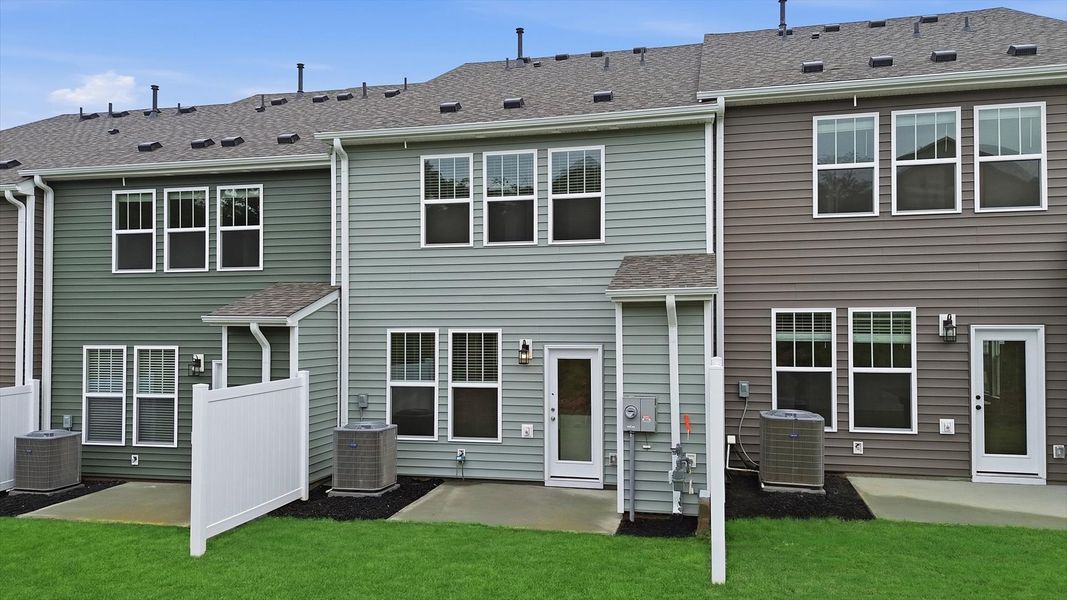 Warm and inviting outdoor living space with a spacious patio and tasteful finishes by DRB Homes Warm and inviting outdoor living space with a spacious patio and tasteful finishes by DRB Homes