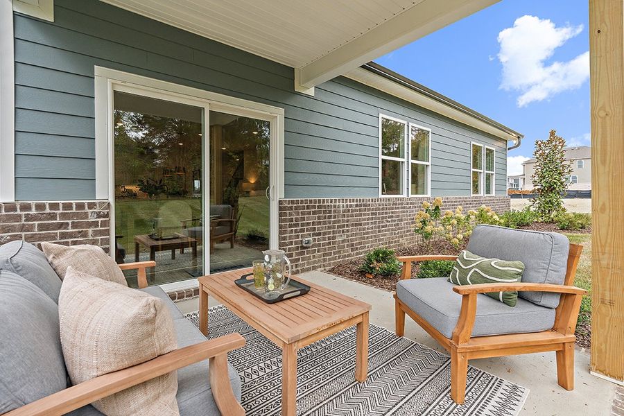 A patio with a table and chairs. A patio with a table and chairs.