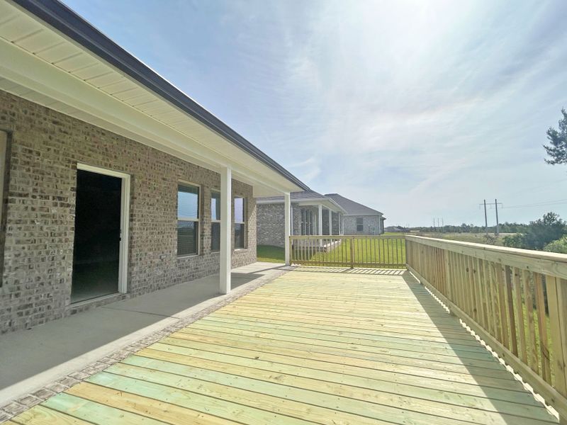 Front exterior of a new home in The Bluffs at Lafayette, Freeport, FL, highlighting curb appeal (Image 15).