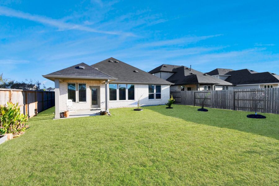 Exterior details and patio area of a home in The Timbers at Mason Woods, Cypress (Image 4).