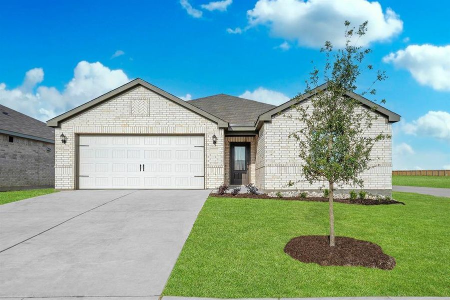 Ranch-style house featuring a garage and a front lawn