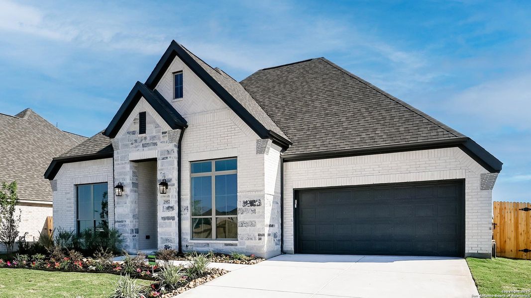 Front exterior of a new home in Meadows Of Mill Creek 60', Seguin, TX, highlighting curb appeal (Image 2).