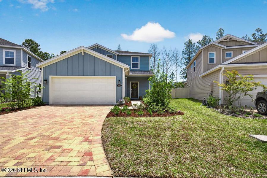 Front exterior of a new home in St Augustine Lakes, St. Augustine, FL, highlighting curb appeal (Image 30).