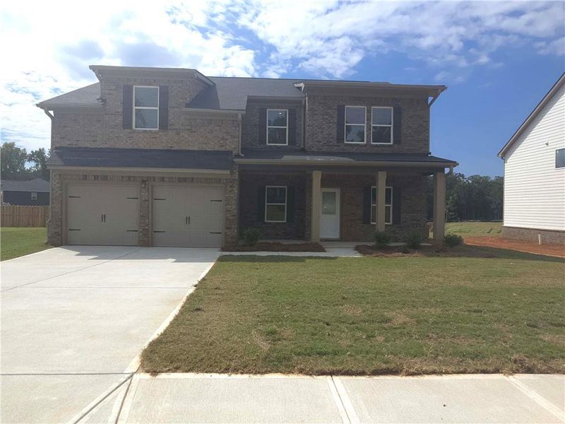 Front exterior of a new home in Southern Hills, McDonough, GA, highlighting curb appeal (Image 13).
