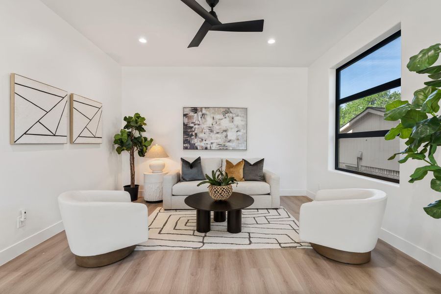 This additional seating space adjacent the living room cultivates a more intimate space or could even be transformed into a private office or study.