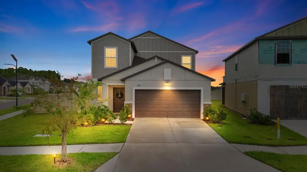 Front exterior of a new home in , Land O' Lakes, FL, highlighting curb appeal (Image 1). Front exterior of a new home in , Land O' Lakes, FL, highlighting curb appeal (Image 1).