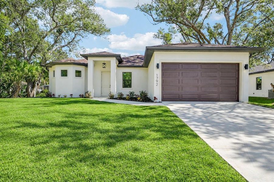 Front exterior of a new home in , North Port, FL, highlighting curb appeal (Image 18).