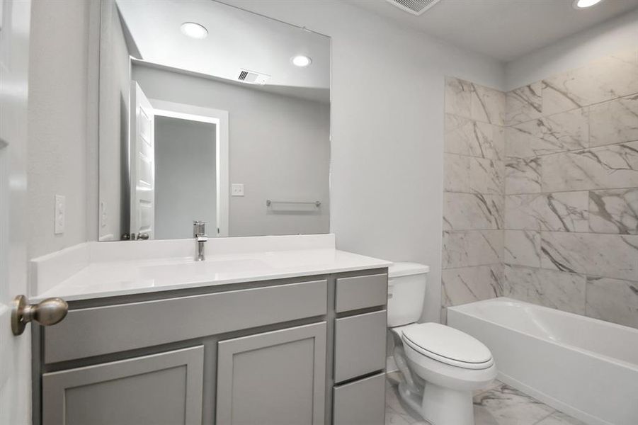 Guest suite full bathroom. Sample photo of completed home with similar floor plan. Actual colors and selections may vary.