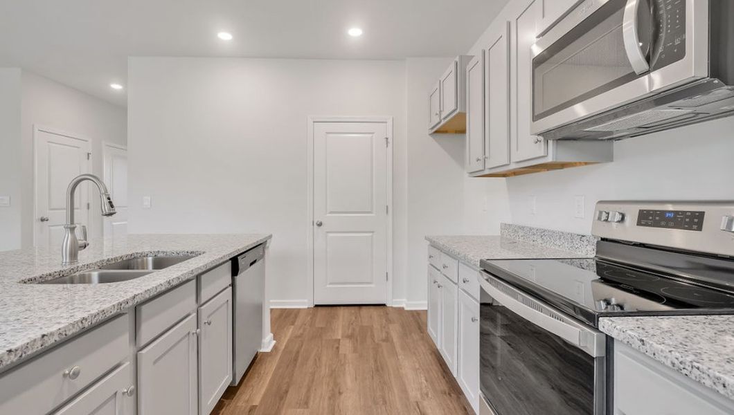 Representative furnished interior of a home built from the GLYNN by D.R. Horton in Grayson Park, Leland (Image 9).