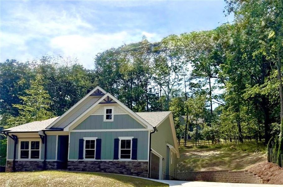 Front exterior of a new home in , Waleska, GA, highlighting curb appeal (Image 1). Front exterior of a new home in , Waleska, GA, highlighting curb appeal (Image 1).