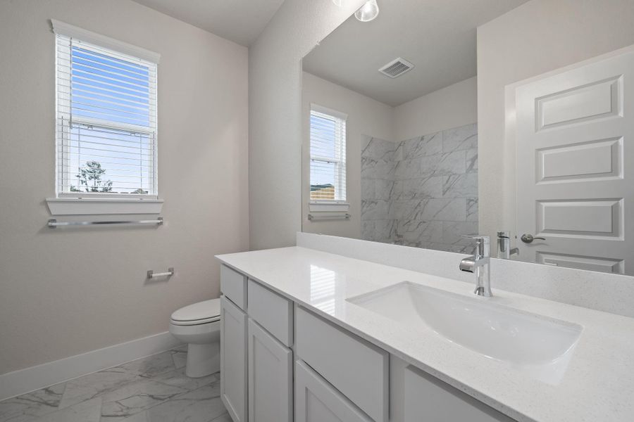 Furnished interior view inside a new home in Barton Creek Ranch, Conroe (Image 6).