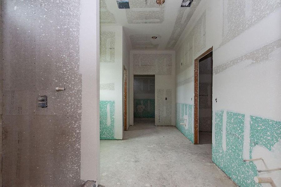 Spacious hallway in the midst of construction, offering a blank canvas to customize finishes and design elements to your taste. Spacious hallway in the midst of construction, offering a blank canvas to customize finishes and design elements to your taste.