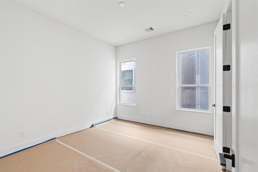 Secondary bedrooms provide ample space and natural light.