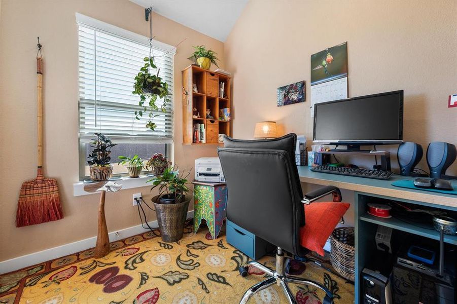 Office area with baseboards and lofted ceiling Office area with baseboards and lofted ceiling