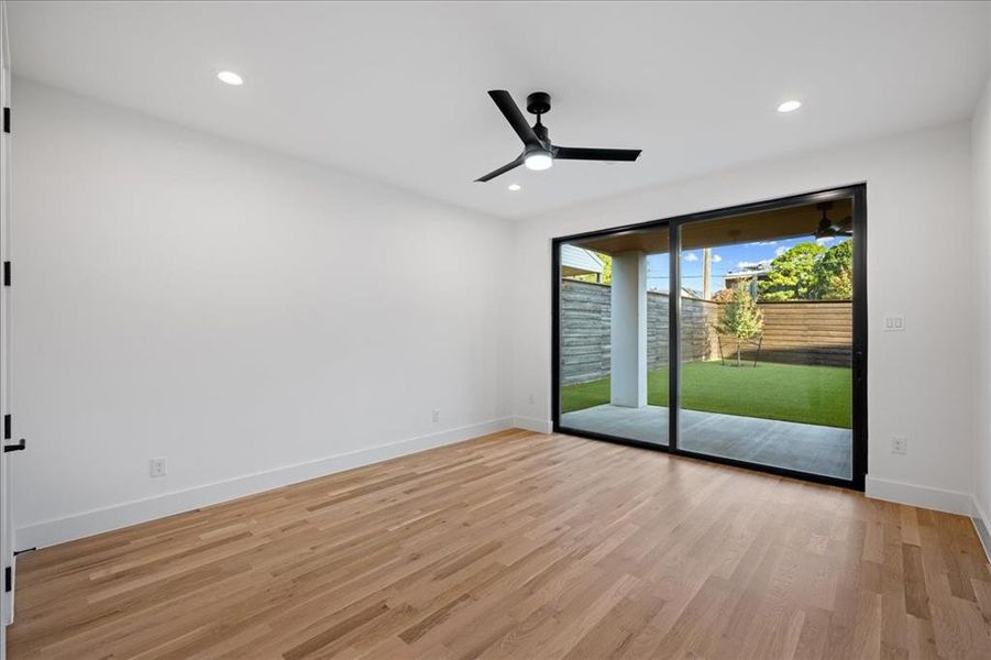 2nd Primary room featuring light wood-style flooring, recessed lighting, and a ceiling fan with view of backyard 2nd Primary room featuring light wood-style flooring, recessed lighting, and a ceiling fan with view of backyard