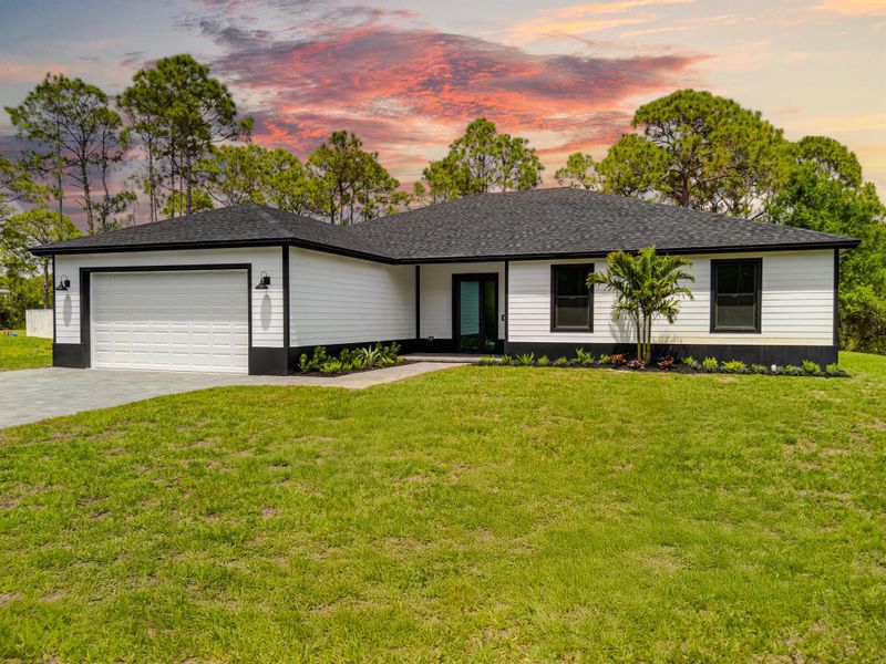 Exterior details and patio area of a home in , The Acreage (Image 2).
