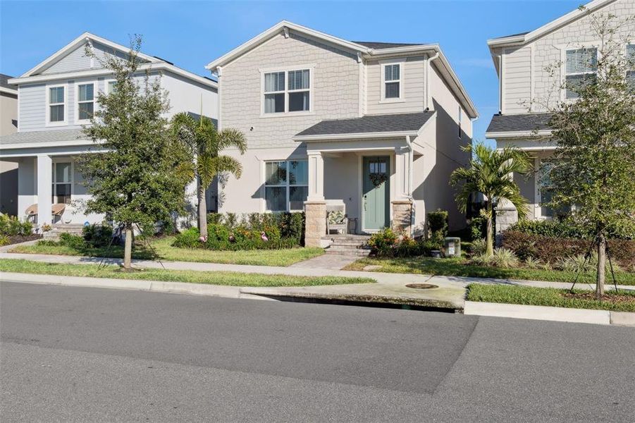 Front exterior of a new home in , Winter Garden, FL, highlighting curb appeal (Image 27).