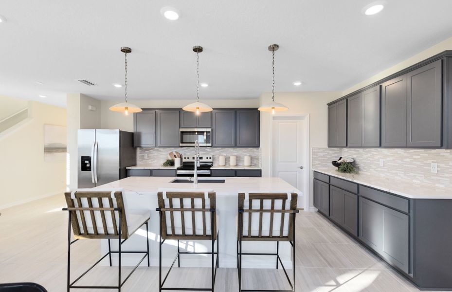Representative furnished interior of a home built from the Mabel II by Pulte Homes in EverBe, Orlando (Image 12).