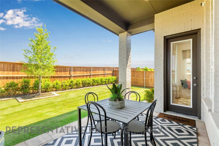 Fenced backyard featuring a patio and outdoor dining space Fenced backyard featuring a patio and outdoor dining space