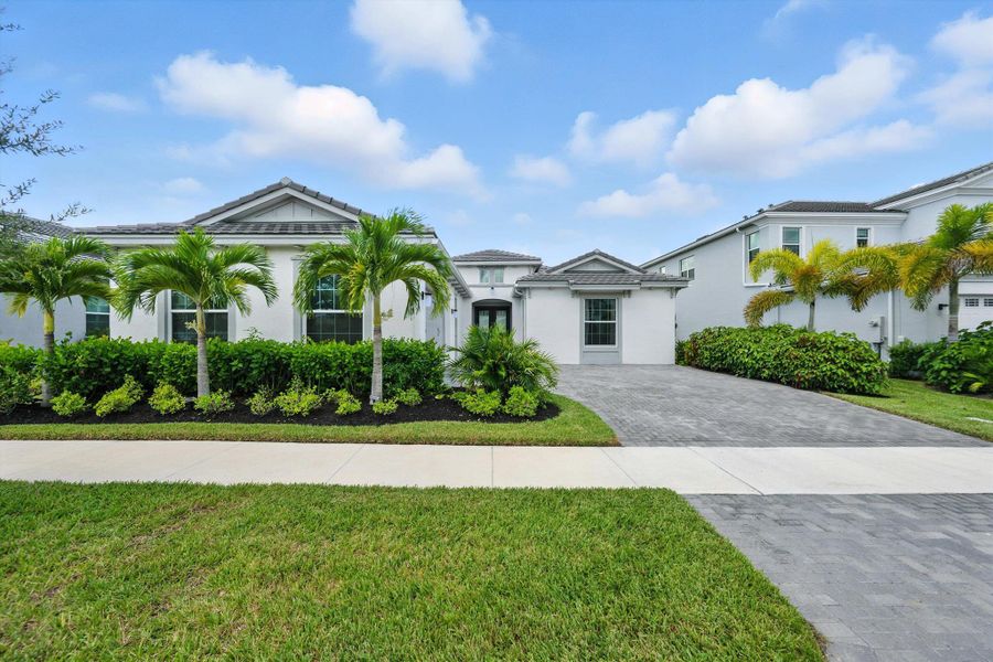 Front exterior of a new home in , Westlake, FL, highlighting curb appeal (Image 24).