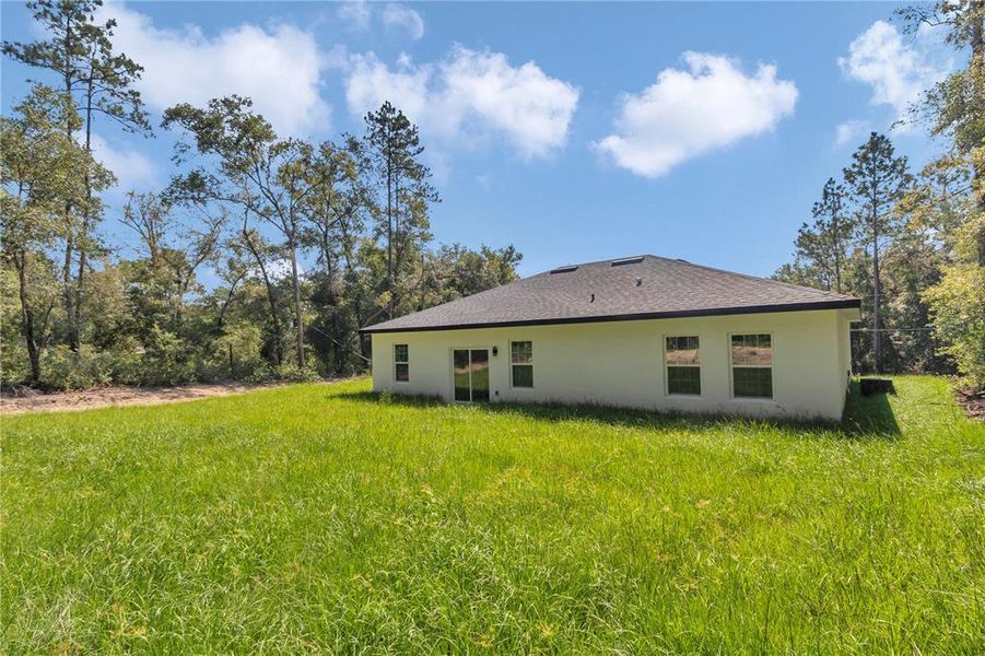 Front exterior of a new home in , Citrus Springs, FL, highlighting curb appeal (Image 15).