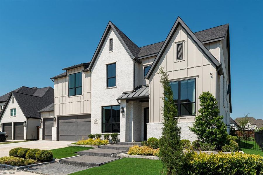 Front exterior of a new home in Light Farms Graham/Reagan, Celina, TX, highlighting curb appeal (Image 2).