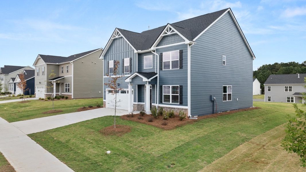 Exterior details and patio area of a home in Preserve at Dove Creek, Statham (Image 2).