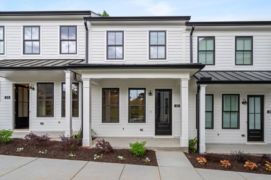 Front exterior of a new home in Harmony, Auburn, GA, highlighting curb appeal (Image 3). Front exterior of a new home in Harmony, Auburn, GA, highlighting curb appeal (Image 3).