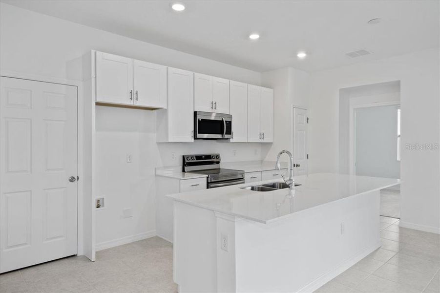 Furnished interior view inside a new home in Mirror Lake Village, Fruitland Park (Image 3).