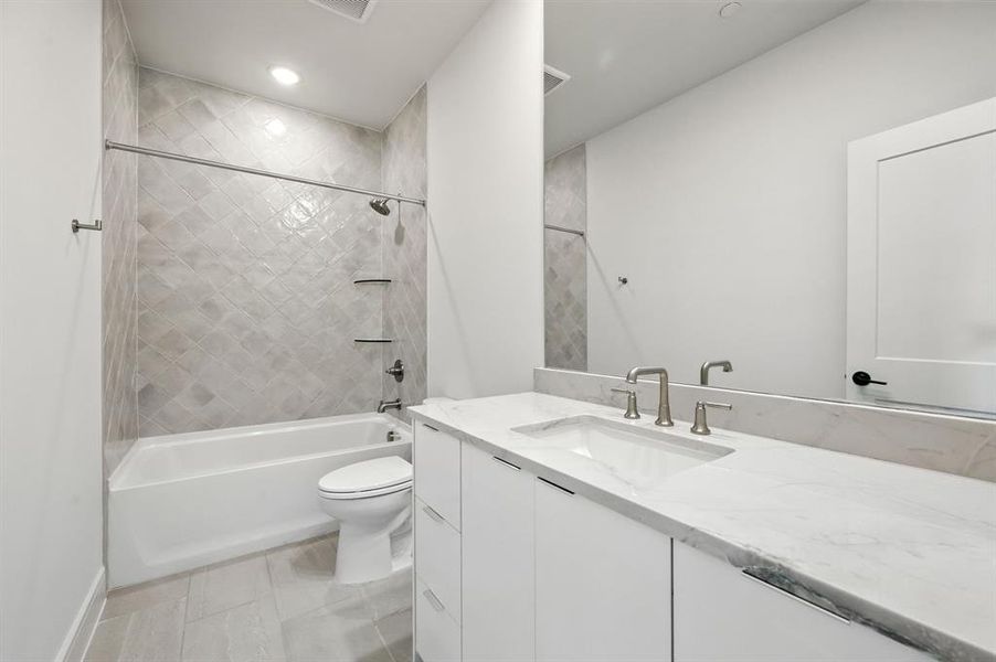 This ensuite bath in the upper floor guest bedroom offers plenty of privacy for guests. This ensuite bath in the upper floor guest bedroom offers plenty of privacy for guests.