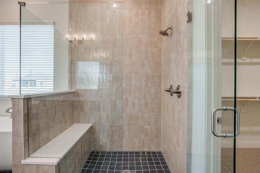 Bathroom featuring walk in shower