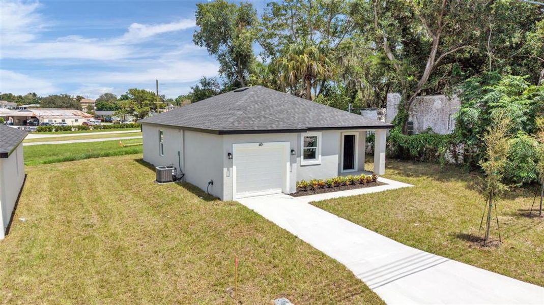 Front exterior of a new home in , Haines City, FL, highlighting curb appeal (Image 19). Front exterior of a new home in , Haines City, FL, highlighting curb appeal (Image 19).