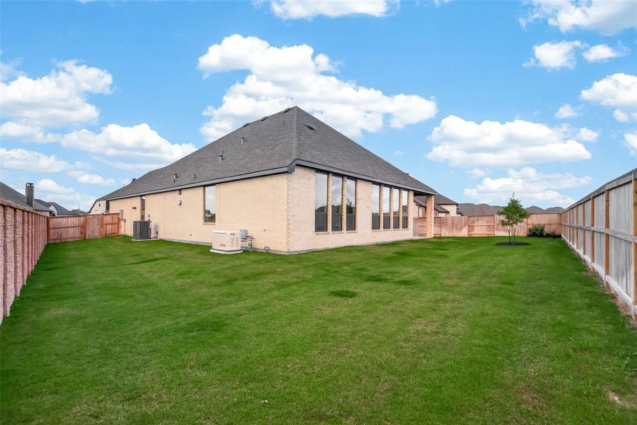 Nicely sized back yard on premium lot with room for kids and pets to run and play!