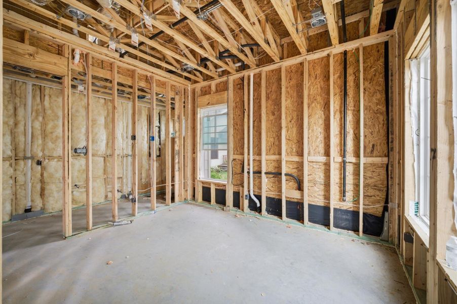 First floor guest suite or optional study.