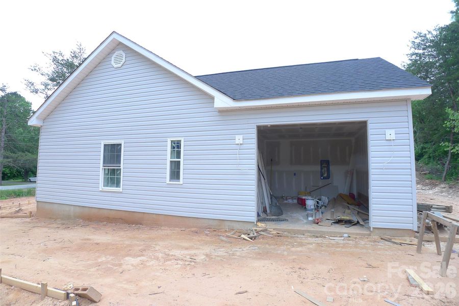 Right side of house and garage Right side of house and garage
