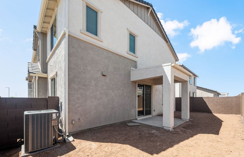 Exterior details and patio area of a home in Asante- Atrium Series, Surprise (Image 3).