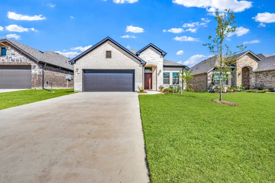 Front exterior of a new home in Summerwood, Red Oak, TX, highlighting curb appeal (Image 21).