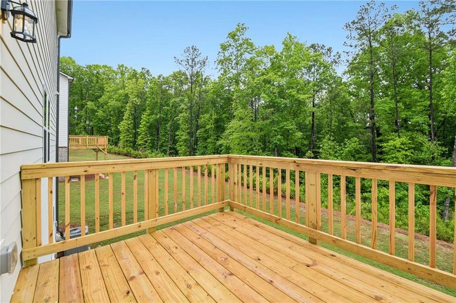 Exterior details and patio area of a home in The Pointe at Heron Bay, Locust Grove (Image 22).