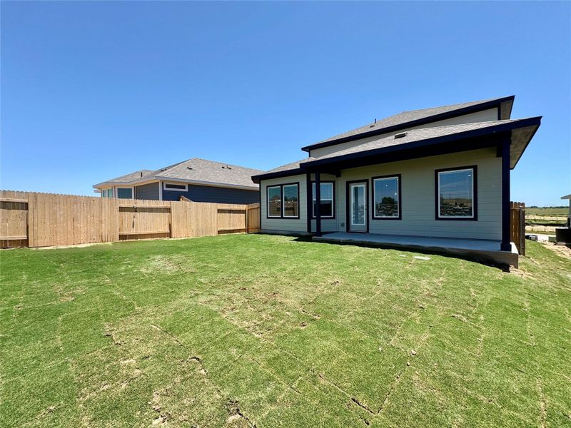 Exterior details and patio area of a home in Turner's Crossing - Reserve Collection, Buda (Image 2). Exterior details and patio area of a home in Turner's Crossing - Reserve Collection, Buda (Image 2).