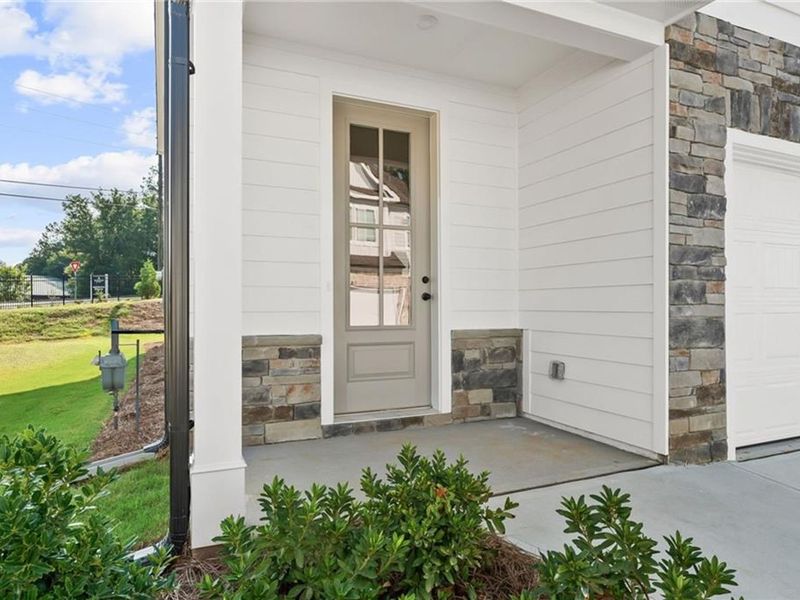 Exterior details and patio area of a home in The Village at Shallowford, Kennesaw (Image 2). Exterior details and patio area of a home in The Village at Shallowford, Kennesaw (Image 2).