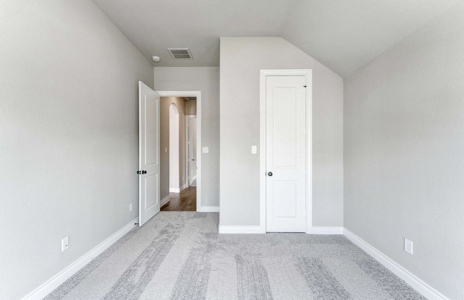 Representative unfurnished interior of a home built from the 2870 by Ravenna Homes in The Woodlands Hills 65′, Willis (Image 33). Representative unfurnished interior of a home built from the 2870 by Ravenna Homes in The Woodlands Hills 65′, Willis (Image 33).