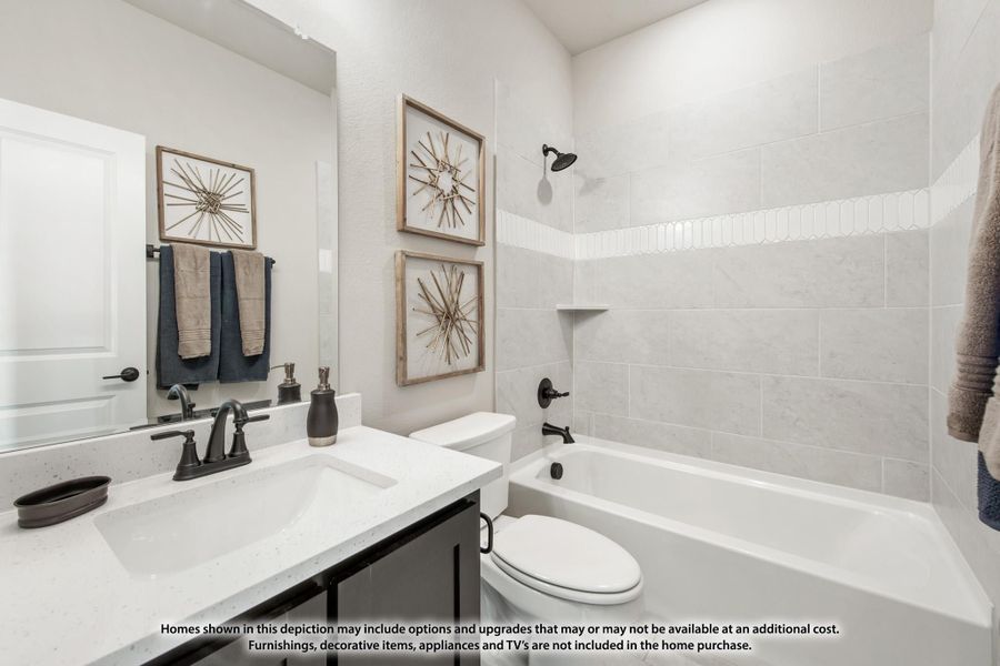 Bathroom with white quartz vanity, soaking tub, tiled shower surround, and dark bronze fixtures Bathroom with white quartz vanity, soaking tub, tiled shower surround, and dark bronze fixtures