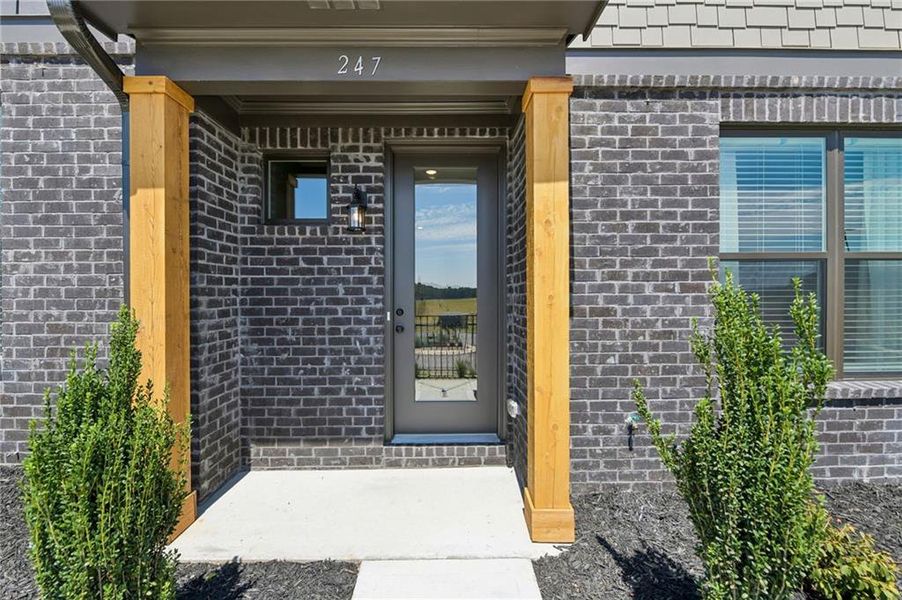 Exterior details and patio area of a home in Tribute, Hoschton (Image 23).