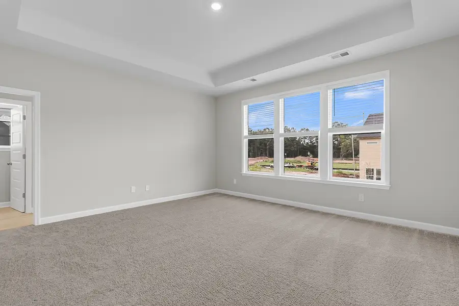 Spacious, unfurnished interior of a new home in Pineland Preserve, Summerville (Image 27).